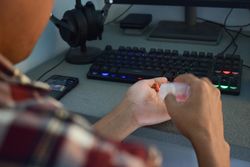 Person pouring prescription pills from container into hand