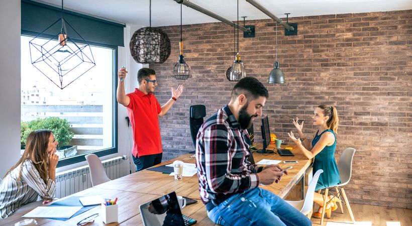 Businessman celebrating success with his coworkers