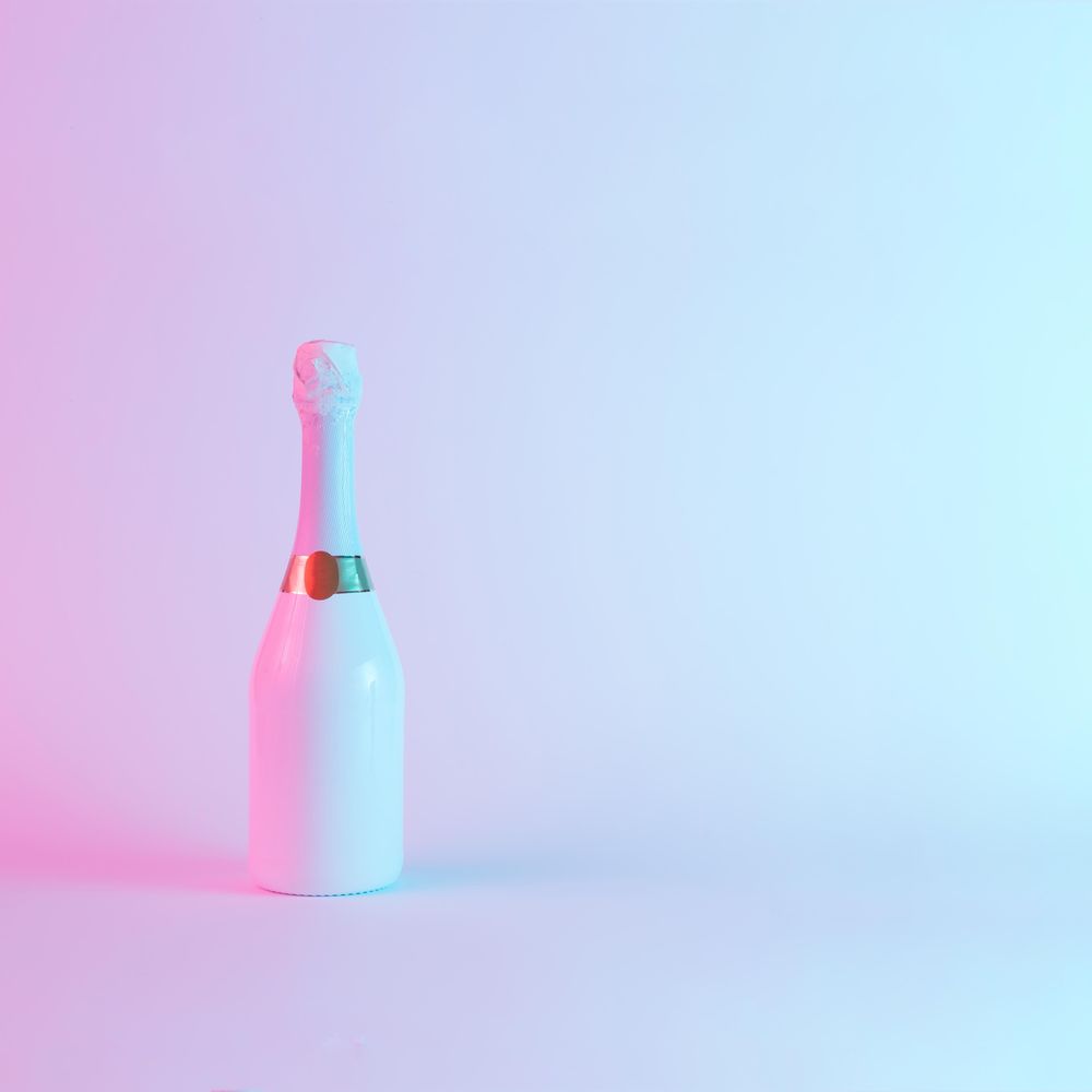 Champagne bottle with colorful ultraviolet holographic neon lights