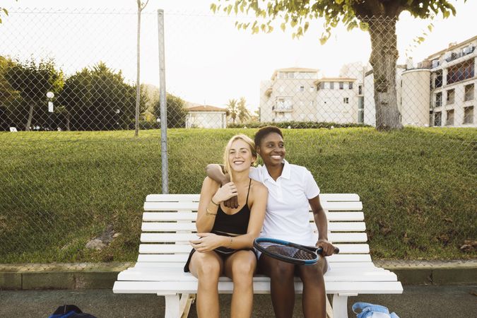 Two women getting ready before a tennis game
