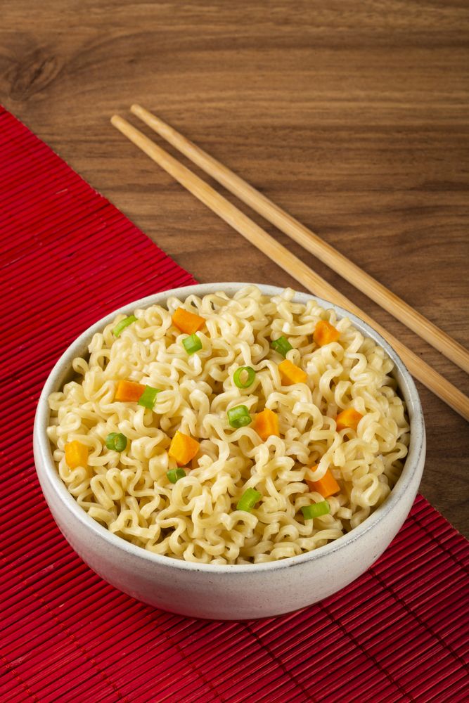 Bowl with instant noodles on the table.
