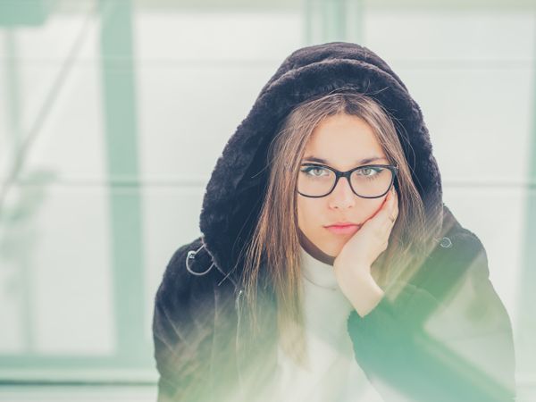 Young woman over a glasses ground