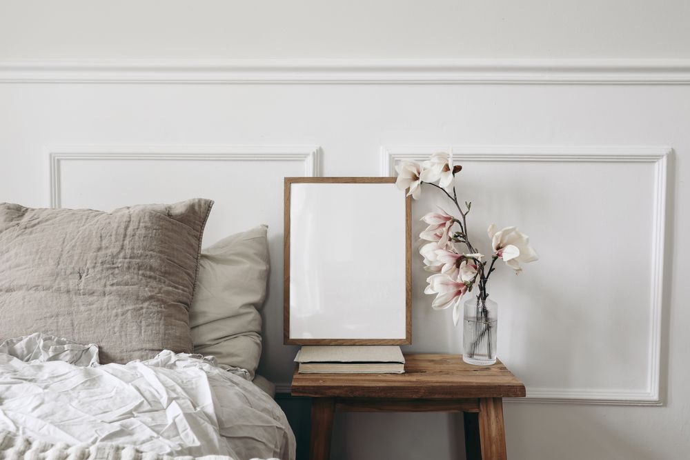 Wooden night stand with fluted glass vase