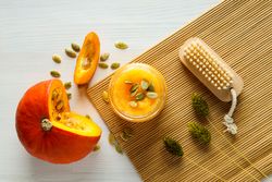 Skin care and face care concept - pumpkin cosmetic