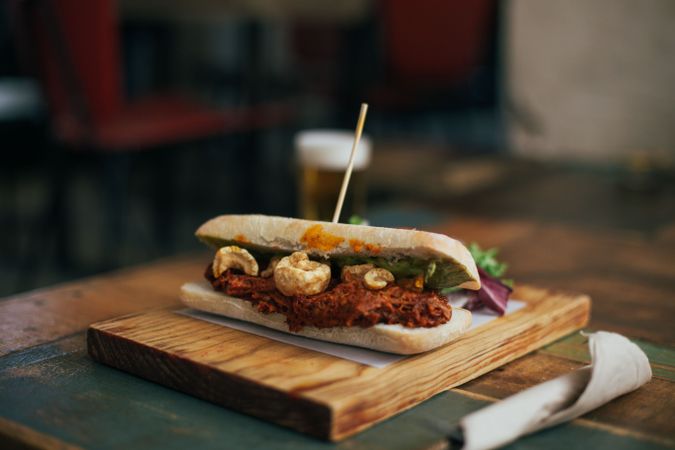 Ciabatta sandwich on wooden board in restaurant