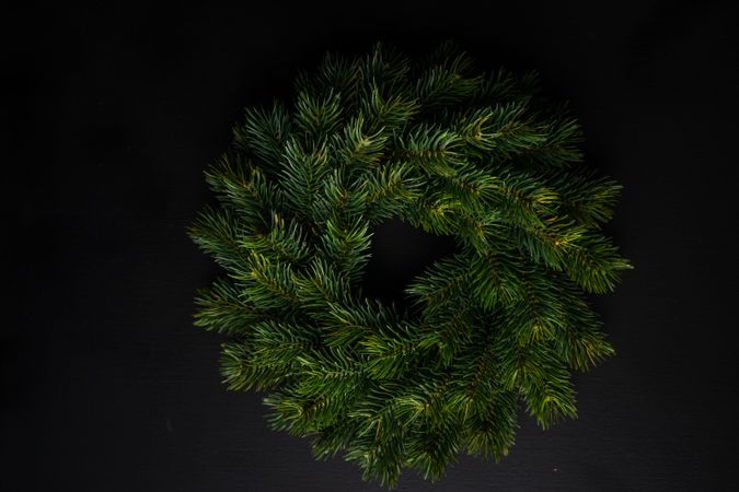 Christmas wreath on dark background with copy space