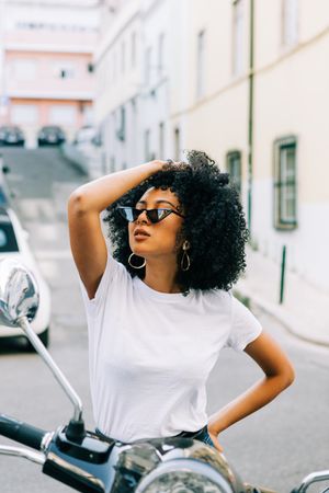 Stylish Black female on motorbike