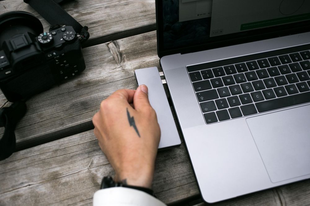 Man with laptop transferring data