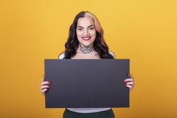 woman holding a blank sign