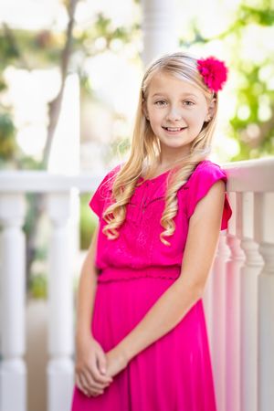 Cute Young Girl Portrait On A Porch