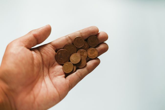 Cents being held in male hand