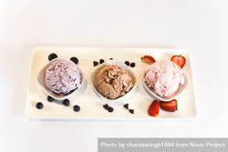 Plate of three different flavored ice cream scoops bG89A0
