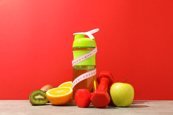 Loss weight accessories on grey table against red background