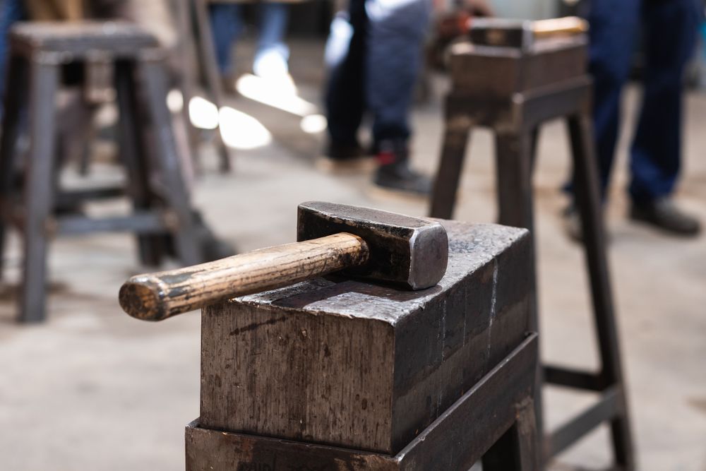 Hammer on workbench in blacksmith workshop