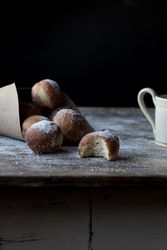 Baked cakes in craft paper on table