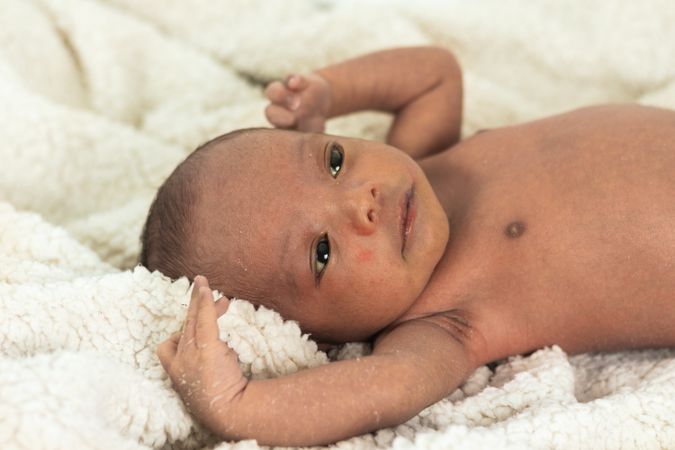 Newborn baby on soft blanket