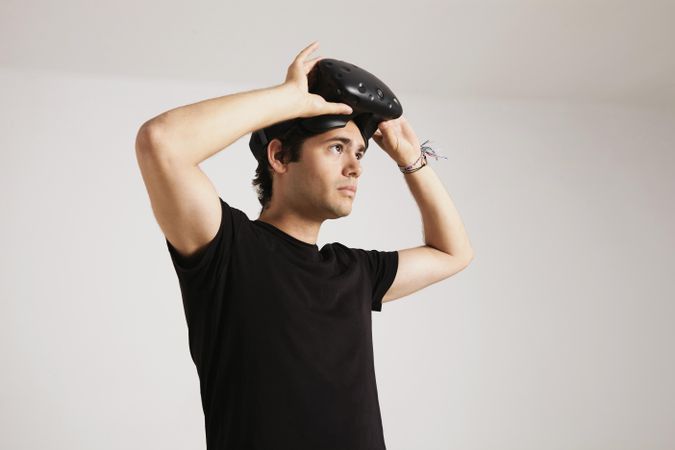 Man removing VR headset