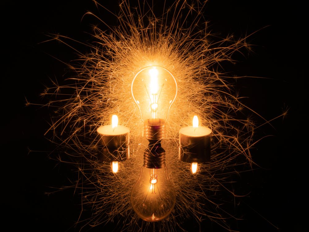 Sparkling light bulb and candles