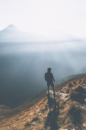 Top view of a person standing on brown mountain