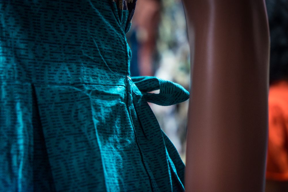 Close up of ribbon of dress on mannequin
