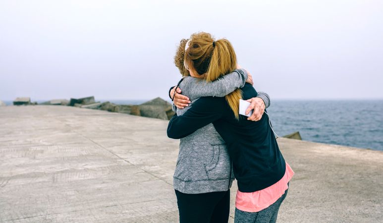 Older and younger woman embracing
