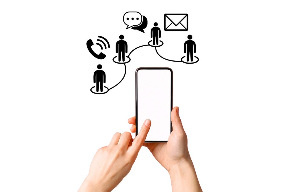 Person using a smartphone to engage in communication with others