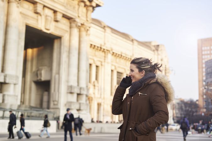 Young woman talking on the phone outdoors