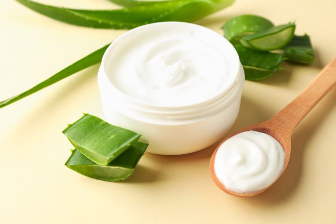Composition with natural treatment accessories on color background, closeup. Aloe vera