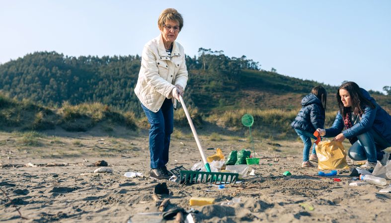 Female volunteers cleaning the beach