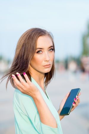 Cosmopolitan businesswoman looking at camera