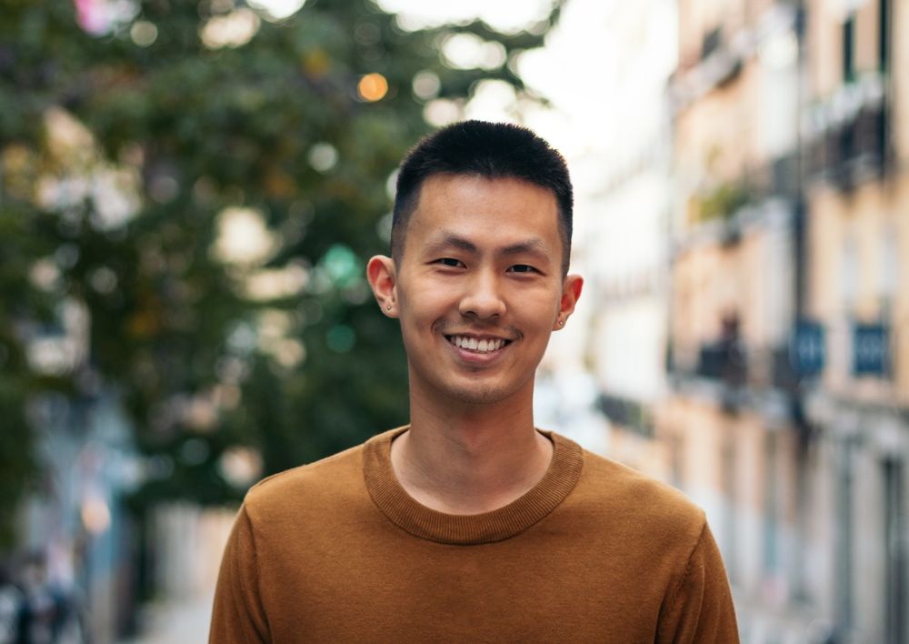 Portrait of a smiling Asian man outdoors