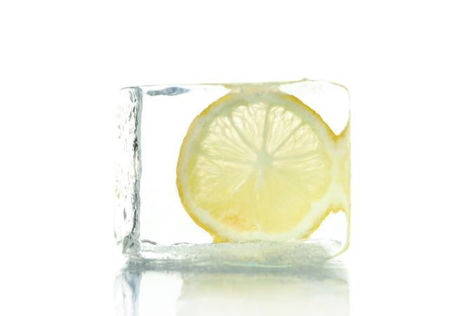 Clear ice cube with lemon slice