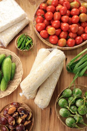 Top View Raw Tempeh with Other Fresh Ingredients before Cooking in the Kitchen