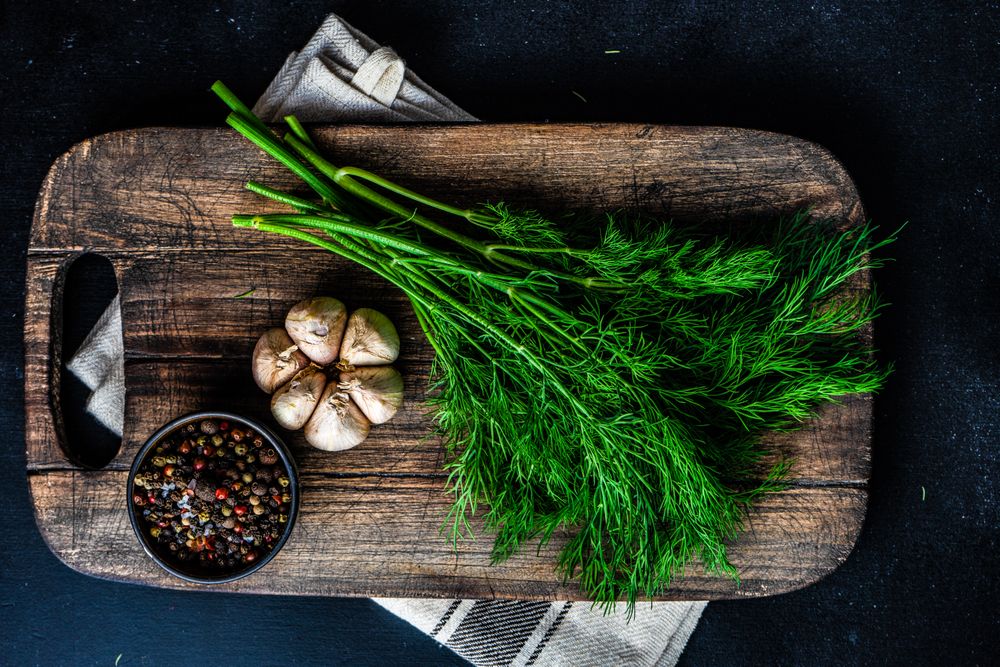 Breadboard with seasonings and garlic