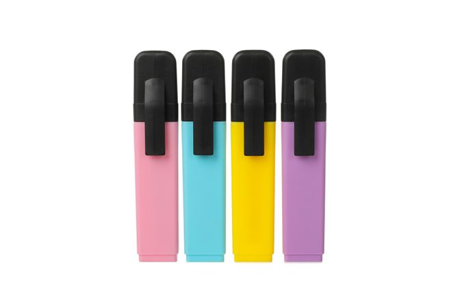 Different color highlighters isolated on blank background