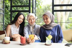 ASian Young Women Hanging Out in a Cafe