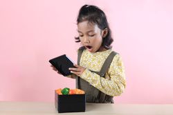 Little Asian Girl Surprised  When Opened Lunch Box