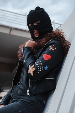Woman in balaclava and leather jacket