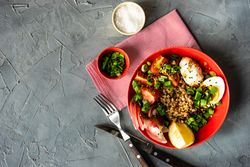 Top view of healthy buckwheat salad bowl