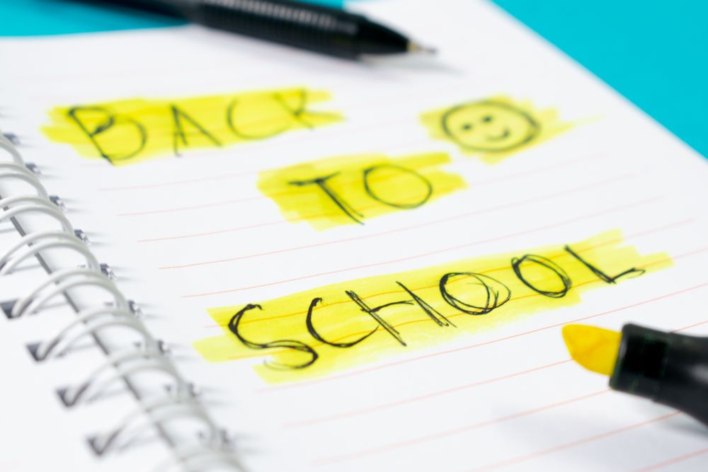 Notebook with writing Back to School with green stabilo
