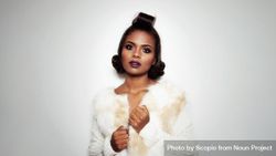 Studio photography of woman wearing makeup and light fur jacket 4Zww3b