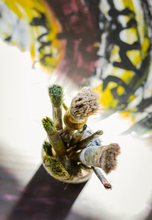 Set of paint brushes on oil painting