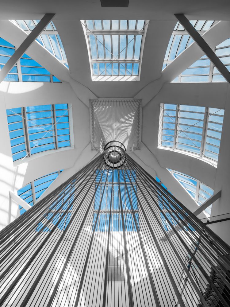 Geometric staircase and glass roof in a modern building. Look up. Library of Strasbourg.