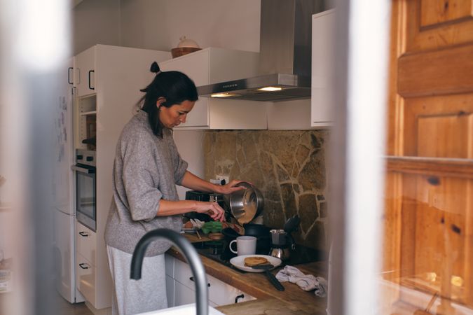 Woman preparing meal in modern kitchen