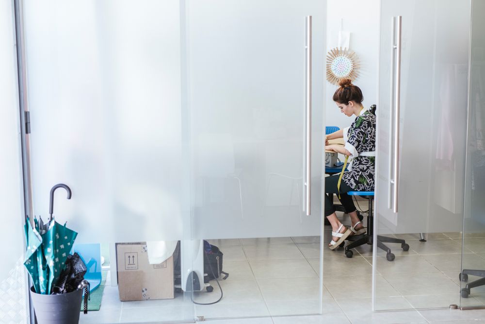 Woman in a sewing school