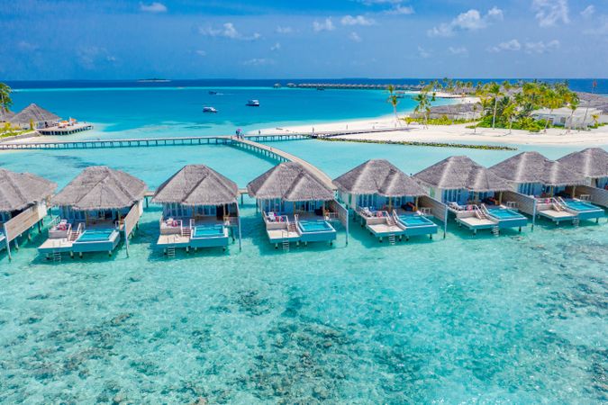 A row of holiday villas in the sea on a beach resort