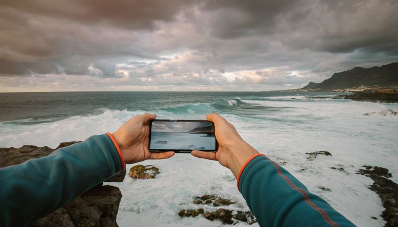 Man taking a picture with phone