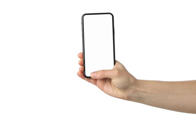 Female hand holding phone with empty screen, isolated on plain background