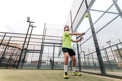 Man playing paddle tennis. low angle