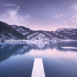Gramolazzo iced lake and snowy pier in Apuan mountains, Garfagnana, Tuscany, Italy